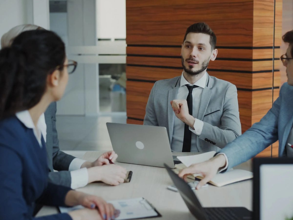 Fountain team members meeting with a client